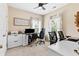 Cozy bedroom featuring carpeted floors, multiple windows, and a ceiling fan with a light at 6069 Queens River Dr, Mableton, GA 30126