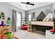 Stylish bedroom with playful mountain mural, unique bunk bed, and ample space for toys and imagination at 6069 Queens River Dr, Mableton, GA 30126