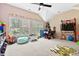 bonus room featuring multiple windows, carpeted floors, games, and natural lighting at 6069 Queens River Dr, Mableton, GA 30126