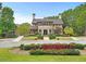 Community clubhouse with manicured landscaping at 6069 Queens River Dr, Mableton, GA 30126
