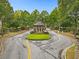 Community entrance to the Providence neighborhood with lush landscaping at 6069 Queens River Dr, Mableton, GA 30126