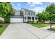 Charming two-story home featuring a welcoming front porch and well-manicured lawn at 6069 Queens River Dr, Mableton, GA 30126