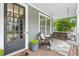 Inviting front porch with seating, perfect for enjoying the outdoors at 6069 Queens River Dr, Mableton, GA 30126