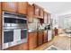 Well-lit kitchen featuring stainless steel appliances, granite countertops, and hardwood floors at 6069 Queens River Dr, Mableton, GA 30126