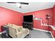 Bright living room features a TV and a cozy sofa at 6069 Queens River Dr, Mableton, GA 30126