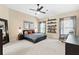 Spacious main bedroom with a walk in closet, large windows and neutral decor at 6069 Queens River Dr, Mableton, GA 30126