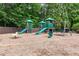 Well-maintained community playground with slides, swings, and other play structures on a mulched surface at 6069 Queens River Dr, Mableton, GA 30126