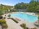 Aerial view of the community pool and tennis court, highlighting outdoor amenities at 6069 Queens River Dr, Mableton, GA 30126