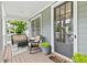 Inviting front porch with outdoor seating, a perfect spot to relax and enjoy the view at 6069 Queens River Dr, Mableton, GA 30126