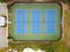 Aerial view of three community tennis courts surrounded by green landscaping at 6069 Queens River Dr, Mableton, GA 30126