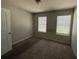 Bedroom with carpet and natural light at 6446 Grey Fox Way, Riverdale, GA 30296