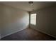 Bedroom featuring carpet and window at 6446 Grey Fox Way, Riverdale, GA 30296
