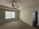 Main bedroom with ceiling fan, trey ceiling and natural light at 6446 Grey Fox Way, Riverdale, GA 30296