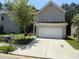 Charming two-story home with a brick-accented garage and well-maintained front yard at 6446 Grey Fox Way, Riverdale, GA 30296