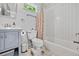 Bathroom with white subway tile, shower and tub combo, and grey vanity at 670 Parker Ave, Decatur, GA 30032
