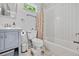 Clean bathroom with white tile, gray vanity, and natural light, creating a spa-like experience at 670 Parker Ave, Decatur, GA 30032