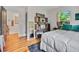 Well-lit bedroom featuring wood floors, ensuite access, and ample natural light at 670 Parker Ave, Decatur, GA 30032