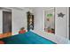Bedroom with hardwood floors, bed, built-in shelving, and attached bathroom at 670 Parker Ave, Decatur, GA 30032