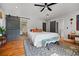 Primary bedroom features sliding barn door, hardwood flooring, and decor at 670 Parker Ave, Decatur, GA 30032