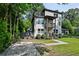 Modern two-story home featuring gray and white exterior, balconies, and a concrete driveway at 670 Parker Ave, Decatur, GA 30032