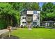 Modern two story home with a yard, mailbox, and small porch with balcony at 670 Parker Ave, Decatur, GA 30032
