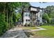 Stunning modern home boasts a two-story exterior with beautiful balconies and landscaping at 670 Parker Ave, Decatur, GA 30032