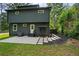 Back exterior of home with concrete patio, leading to meticulously styled backyard at 670 Parker Ave, Decatur, GA 30032