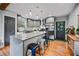 Modern kitchen featuring stainless steel appliances, granite countertops, an island and ample cabinet space at 670 Parker Ave, Decatur, GA 30032