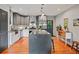 Beautiful kitchen featuring stainless steel appliances, a spacious island, ample counter space and gray cabinetry at 670 Parker Ave, Decatur, GA 30032