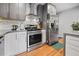 Well-equipped kitchen featuring stainless steel appliances, white cabinetry, and sleek countertops at 670 Parker Ave, Decatur, GA 30032