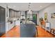 Modern kitchen with stainless steel appliances, an island with seating, and stylish cabinets at 670 Parker Ave, Decatur, GA 30032