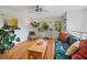 Bright living room with hardwood floors, large windows, ceiling fan, and stylish decor at 670 Parker Ave, Decatur, GA 30032