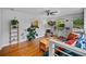 Cozy living room with hardwood floors, lots of plants, and multiple windows at 670 Parker Ave, Decatur, GA 30032