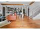 Spacious living area with hardwood floors, kitchen view, and staircase, perfect for modern living at 670 Parker Ave, Decatur, GA 30032