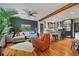 Bright living room with hardwood floors, modern decor and seamless flow into the modern kitchen area at 670 Parker Ave, Decatur, GA 30032
