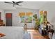 Bright main bedroom with natural lighting through multiple windows and featuring warm wood floors at 670 Parker Ave, Decatur, GA 30032