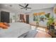 Bright main bedroom with an ensuite doorway, warm wood floors, and lots of natural light at 670 Parker Ave, Decatur, GA 30032