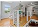 Modern staircase with natural light, hardwood flooring, and contemporary design at 670 Parker Ave, Decatur, GA 30032