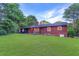 Home exterior with a nice brick finish and lush green landscaping at 1091 Pine St, Conyers, GA 30012