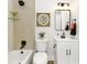 Well-lit bathroom with a modern vanity, sleek mirror, and stylish fixtures at 1091 Pine St, Conyers, GA 30012