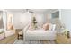 Bright bedroom with light wood floors, neutral paint, and modern accents at 1091 Pine St, Conyers, GA 30012
