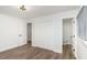 Bedroom with hardwood floors, a closet with bifold doors and an ensuite at 1091 Pine St, Conyers, GA 30012