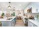 Open concept kitchen with a center island, stainless appliances, and dining area in view at 1091 Pine St, Conyers, GA 30012