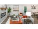 Cozy living room featuring a grey sofa, fireplace, wood floors and modern decor for a relaxing atmosphere at 1091 Pine St, Conyers, GA 30012