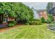 Well-maintained backyard with green grass and lush landscaping at 3499 Paces Ferry Se Cir, Smyrna, GA 30080