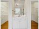 Bright bathroom features a vanity with storage and a large mirror at 3499 Paces Ferry Se Cir, Smyrna, GA 30080