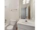 Bathroom features a toilet, bathtub, vanity and a large mirror at 3499 Paces Ferry Se Cir, Smyrna, GA 30080