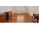 Bedroom with hardwood floors, furniture, and natural light from windows at 3499 Paces Ferry Se Cir, Smyrna, GA 30080