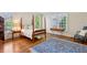Bedroom featuring hardwood floors, natural light and a four-poster bed at 3499 Paces Ferry Se Cir, Smyrna, GA 30080