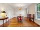Formal dining room with hardwood floors, traditional furnishings, and a chandelier at 3499 Paces Ferry Se Cir, Smyrna, GA 30080